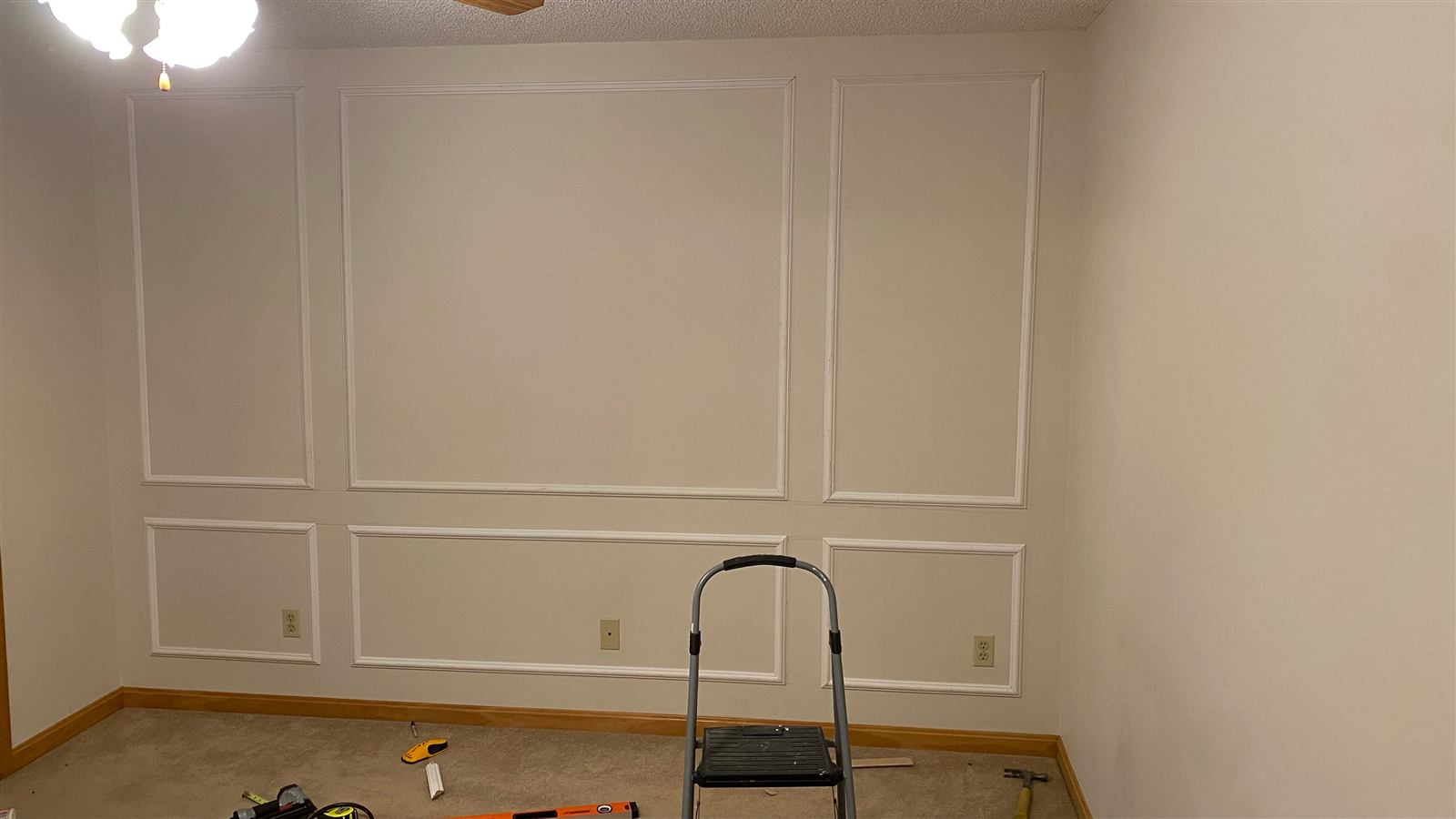 Picture-frame trim installed on the wall before paint