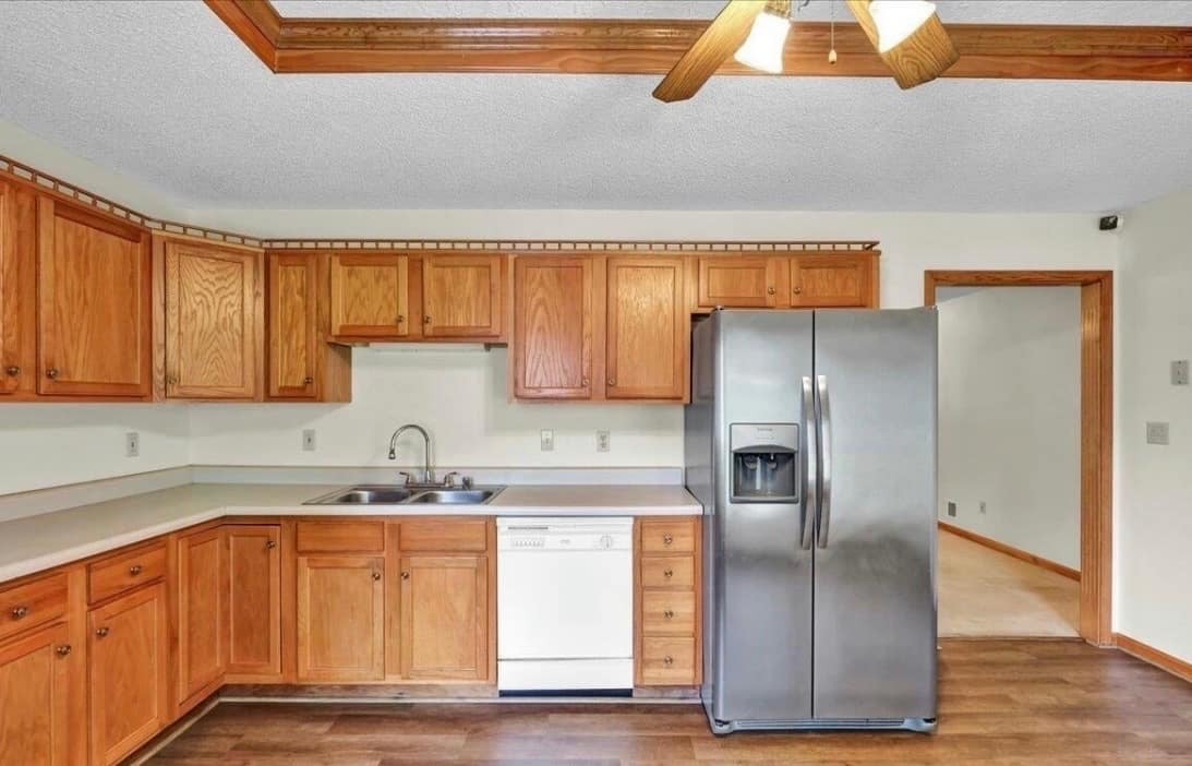 Kitchen before renovation, closed off from the living room