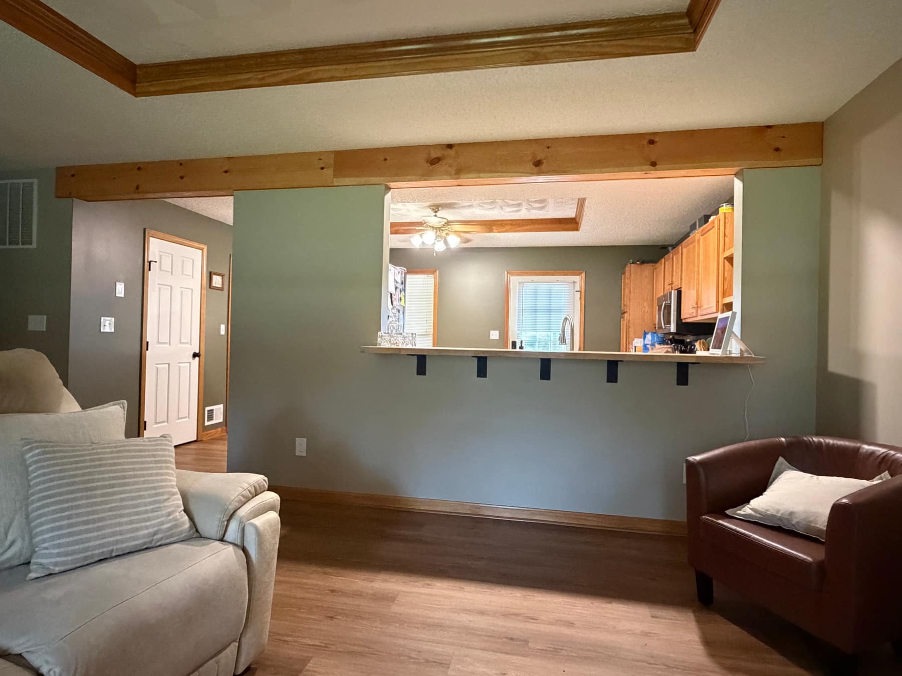 Living room after renovation with new pass-through counter into the kitchen